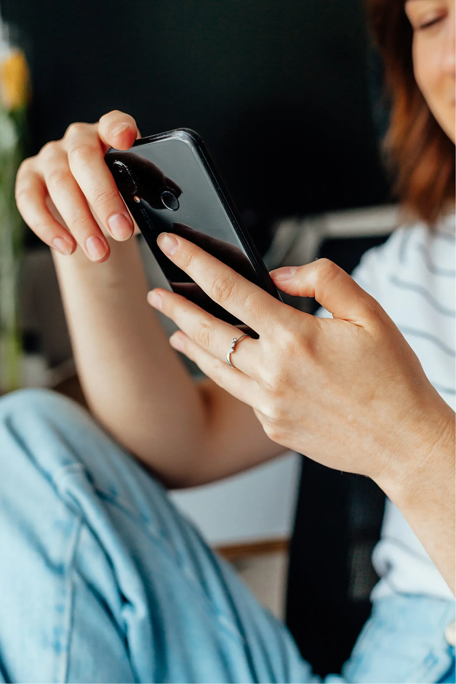 A customer reading a text message on their phone