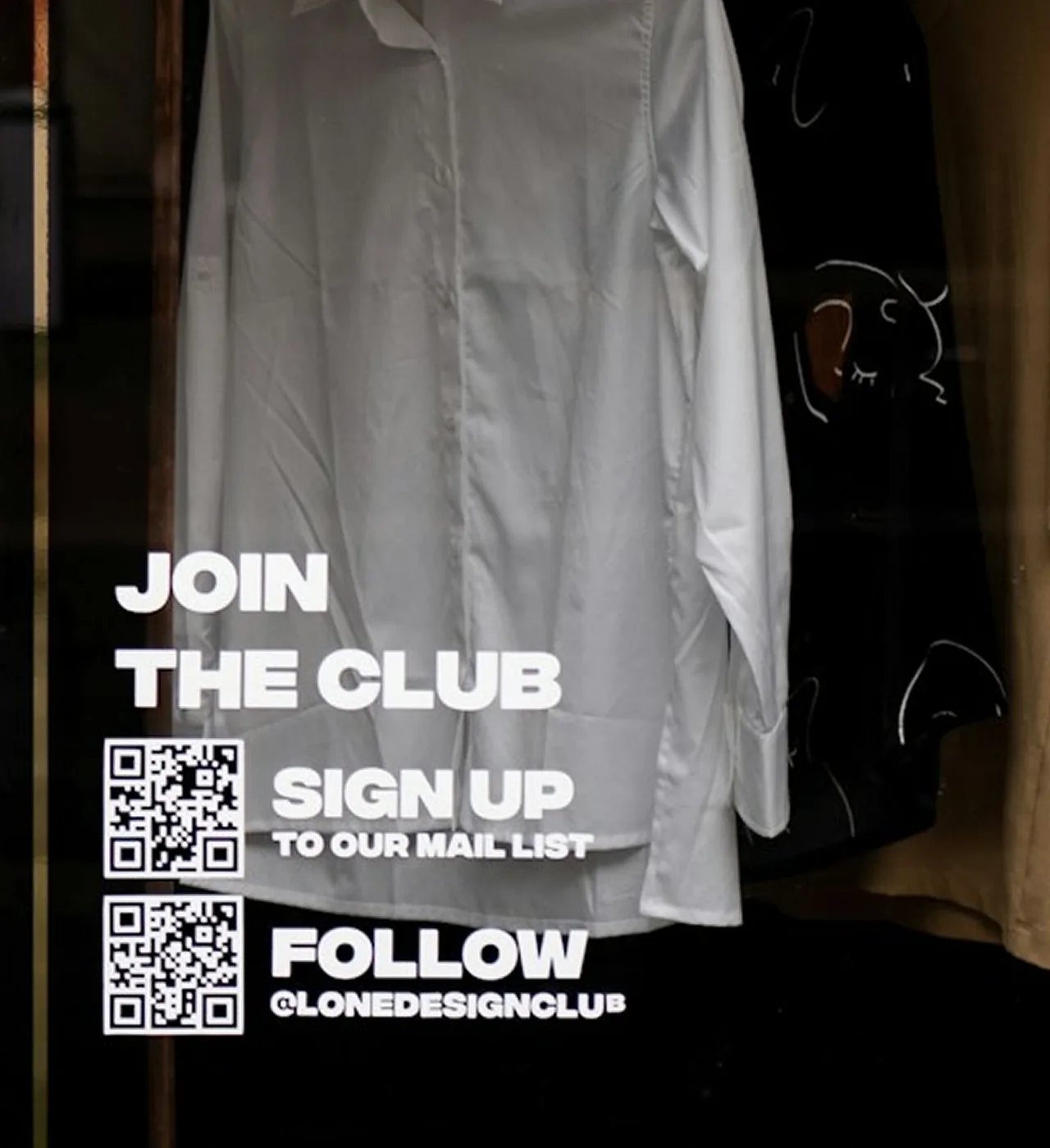 In-store signage reading Join the Club with QR codes for mailing list signup