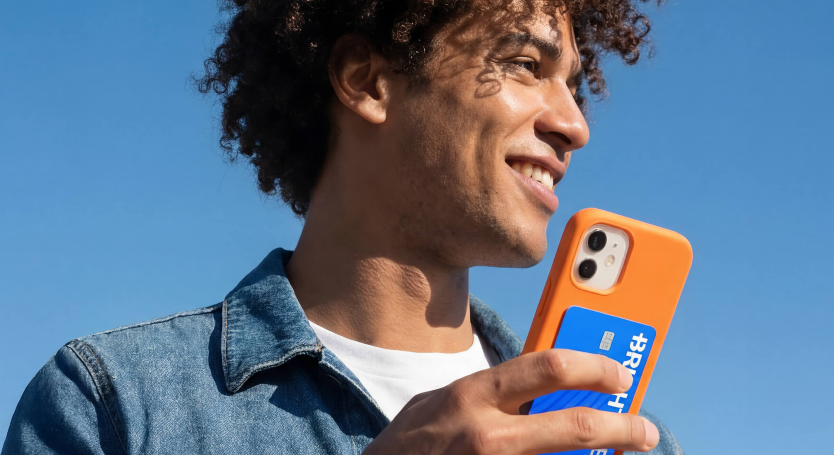 man with phone and Brightwell card
