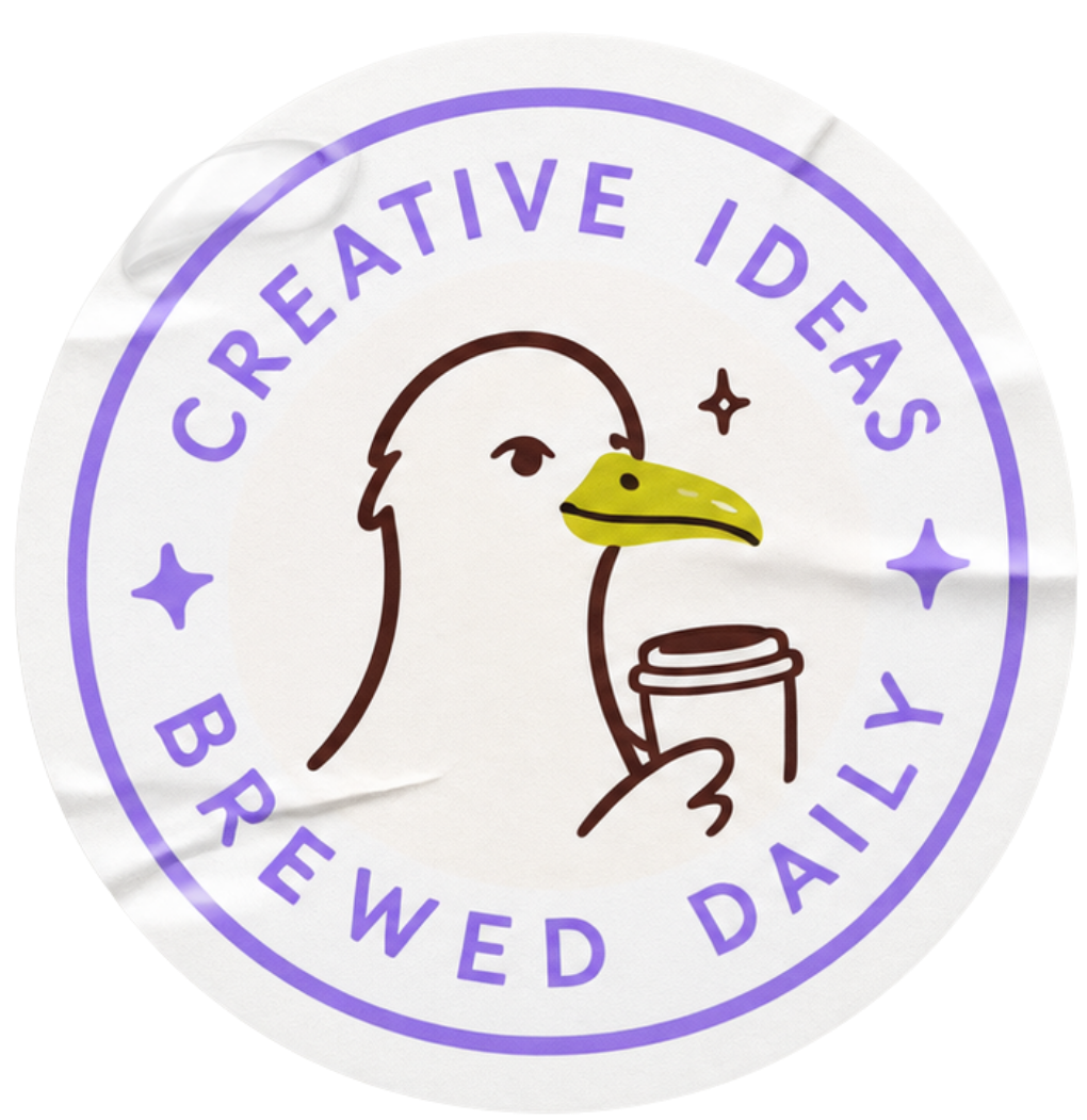 Pyöreä leima, jossa on harmaavalkoinen lokki, jolla keltainen nokka ja kädessä pidettävä kahvikuppi, ympärillään teksti "Creative Ideas Brewed Daily" violettina.