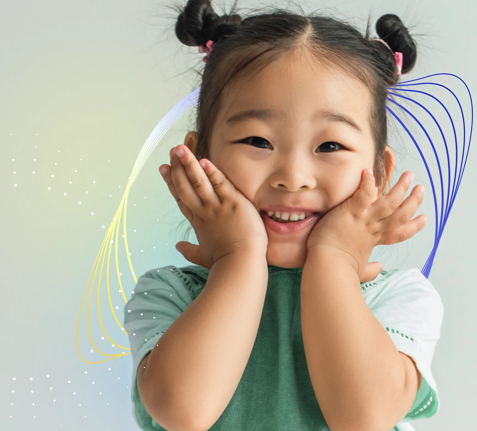 Young girl smiling with her hands on her cheeks