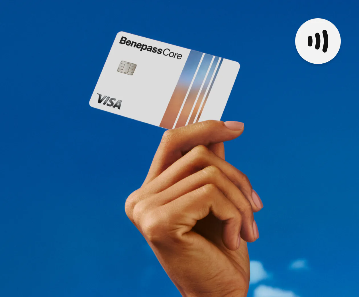 Hand holding up a Benepass Core card against a blue sky
