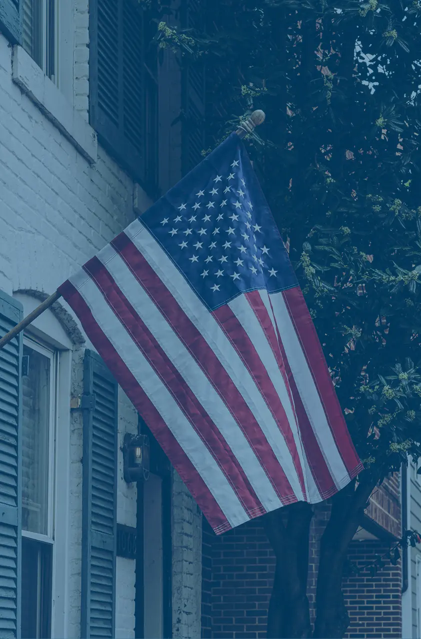 American flag hanging outside home