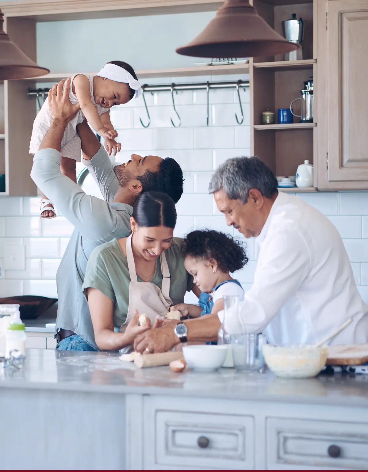 Multigenerational family cooking in the kitchen