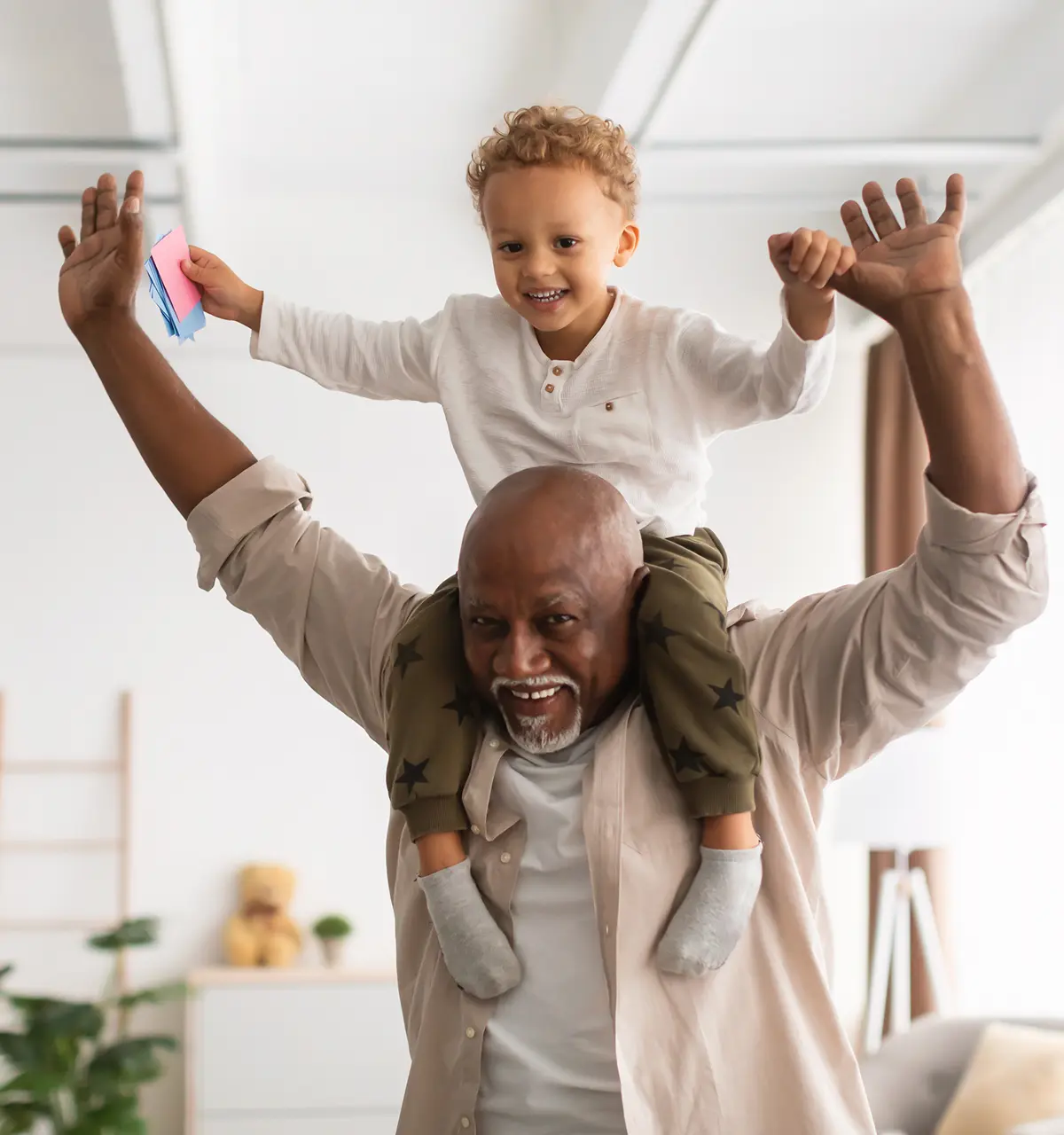 Grandfather holding grandson on his shoulders