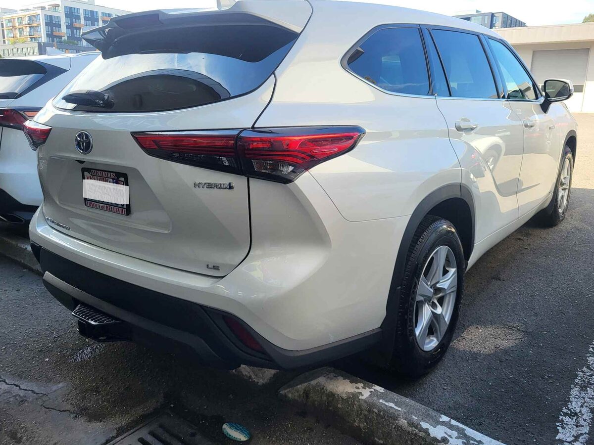 The same Highlander after repair, the quarter panel straight and the new bumper cover matched to the surrounding paint
