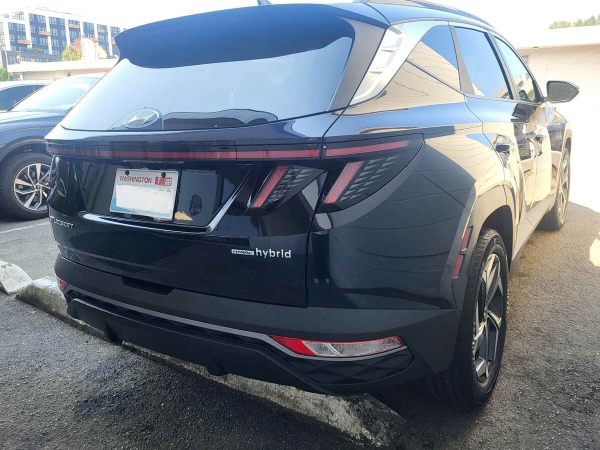 The same Tucson after repair, a new bumper cover aligned to the tailgate and refinished in black