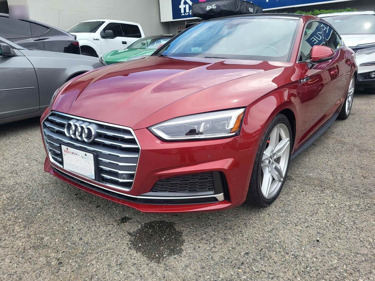 The same A5 after repair, the bumper refitted and refinished with even gaps across the nose