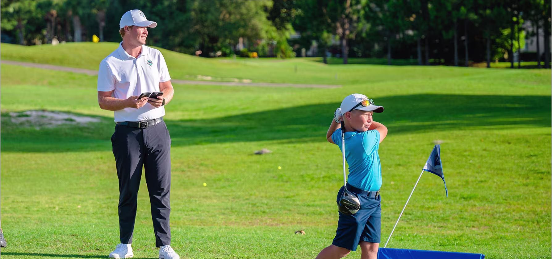 Golfer teeing off at golden-hour sunset during a relaxed evening social round