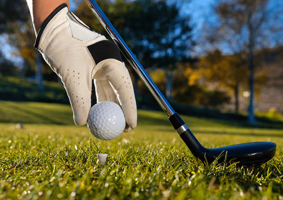 Golfer teeing off
