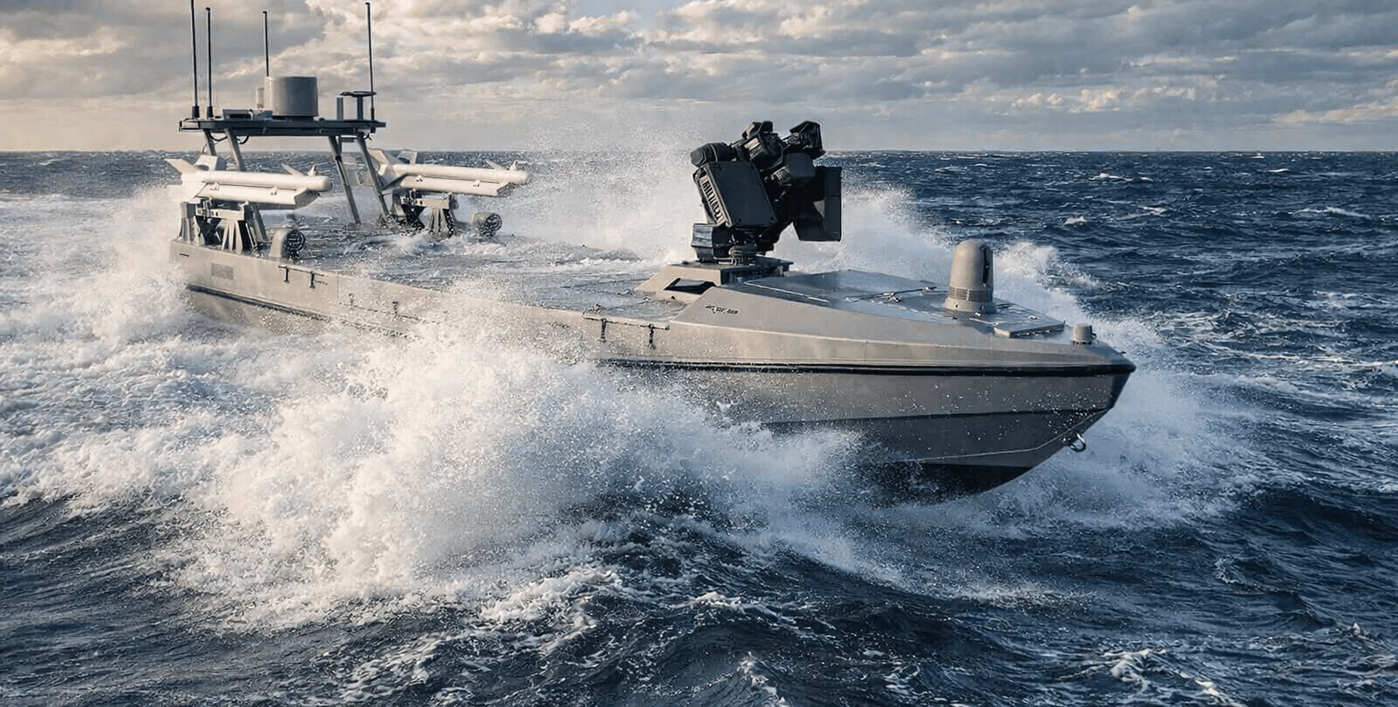 Unmanned military boat equipped with missile launchers and a turret, cutting through choppy ocean waters.