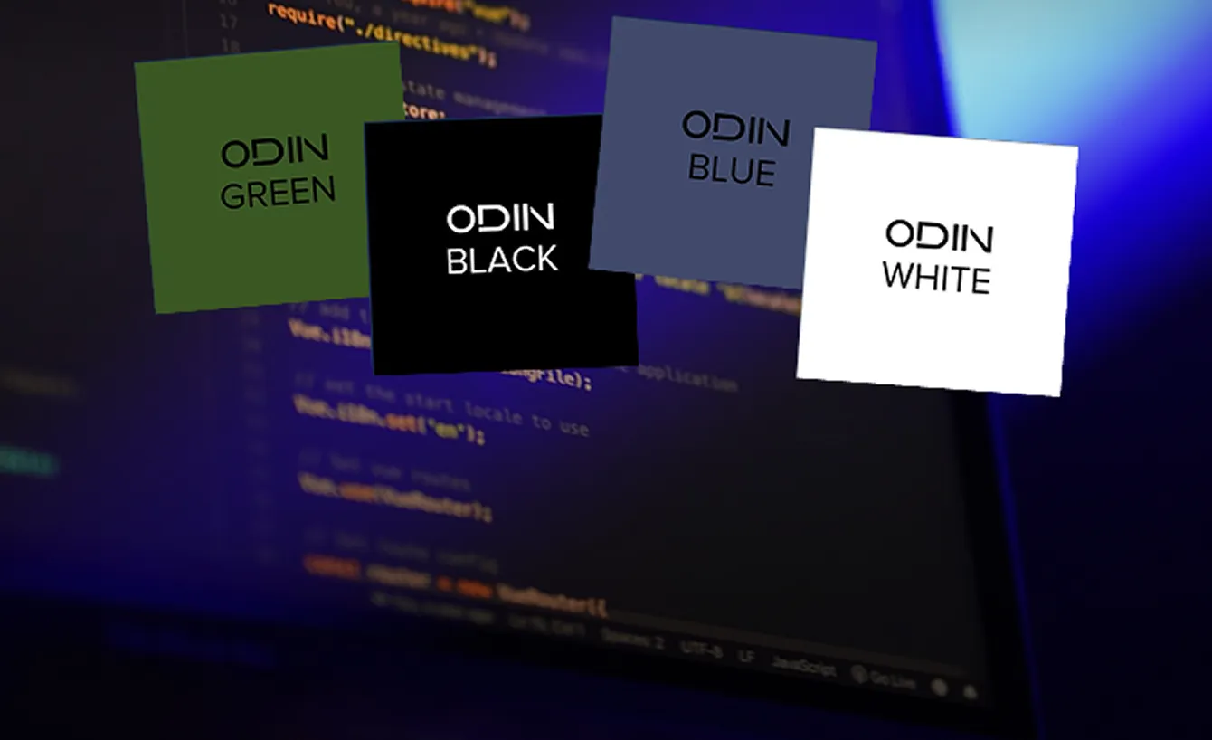 背景にコードが表示された画面の前に、ODINの色オプションとして緑、黒、青、白の各正方形が並んでいる。
