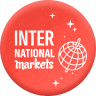 Logo rond rouge avec texte blanc divisant 'INTER' en haut et 'NATIONAL markets' en bas à droite, avec une icône de globe terrestre à droite indiquant les marchés internationaux.