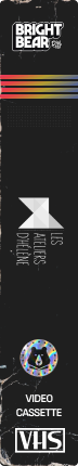 Image vertical showing a black background with rainbow-colored horizontal stripes, text reading 'BRIGHT BEAR', 'in:si:tu art & strategies', a circular logo with a bear and a triangle, the words 'VIDEO CASSETTE', and 'VHS'.