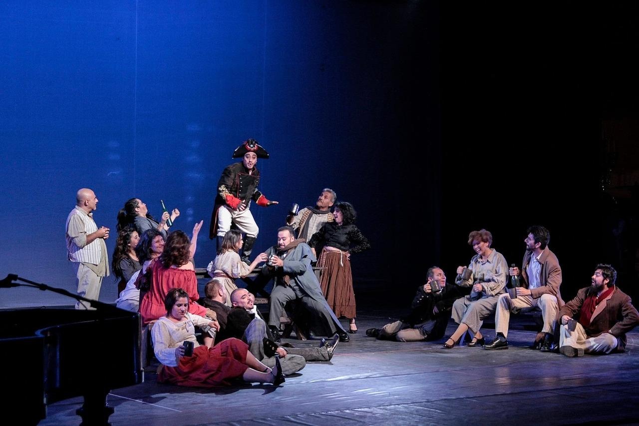 A group of people on a stageDescription automatically generated