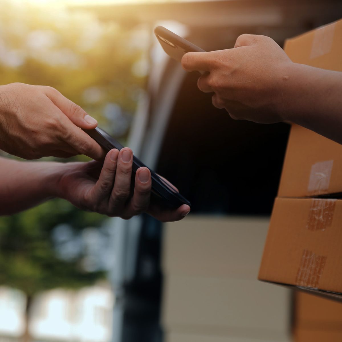 Driver scanning a parcel with the FleetX app