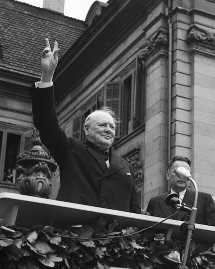 Winston Churchill making the victory sign on the speaker's platform in Zurich, 1946