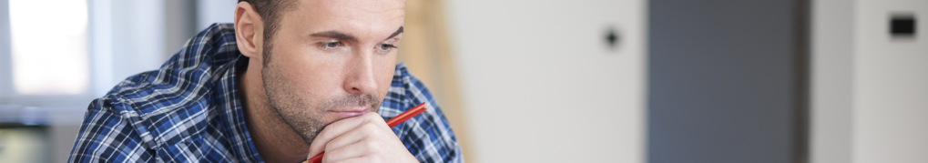Image of man looking at laptop