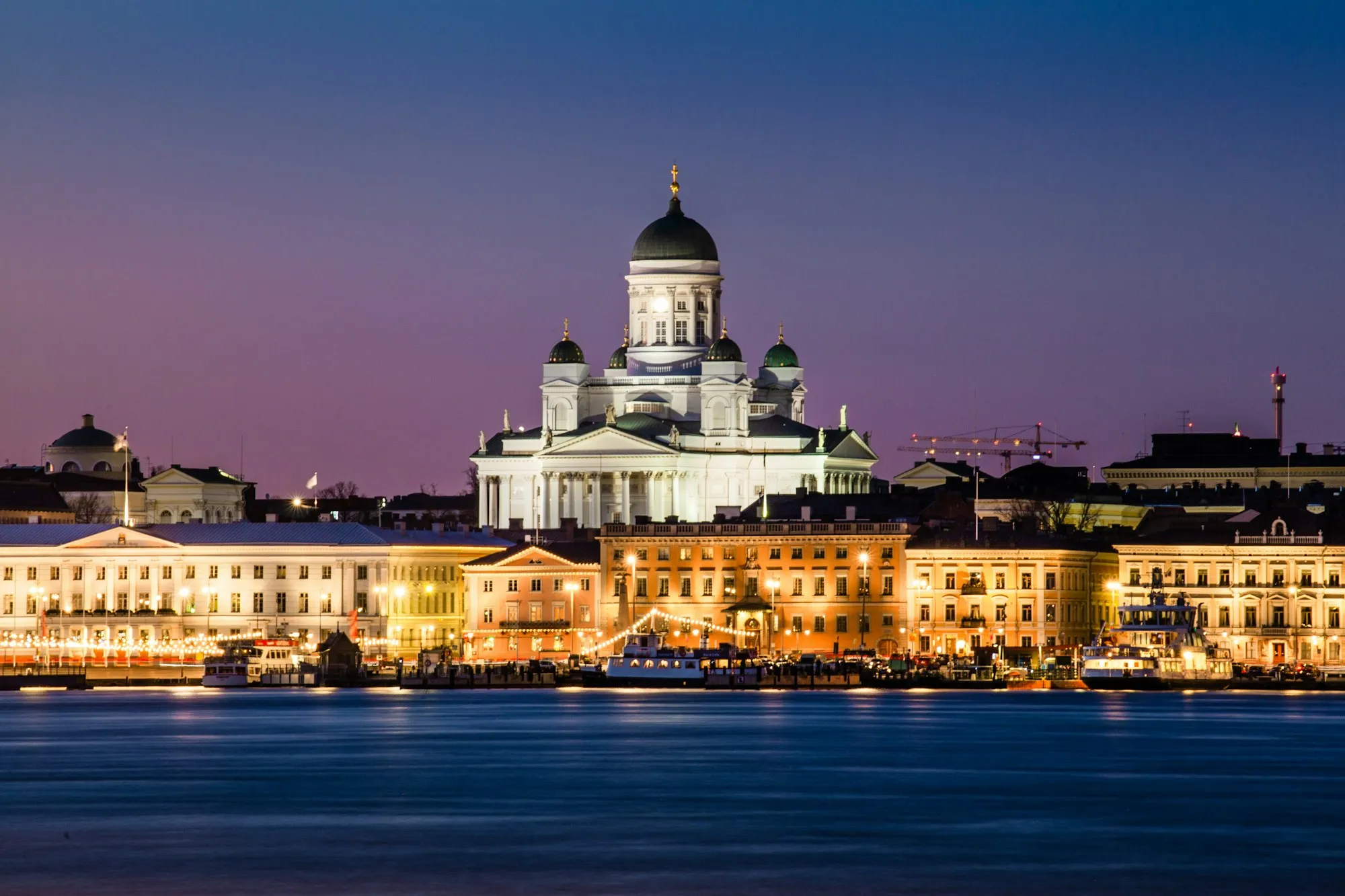 Helsinki Cathedral lit up at night above the city centre
