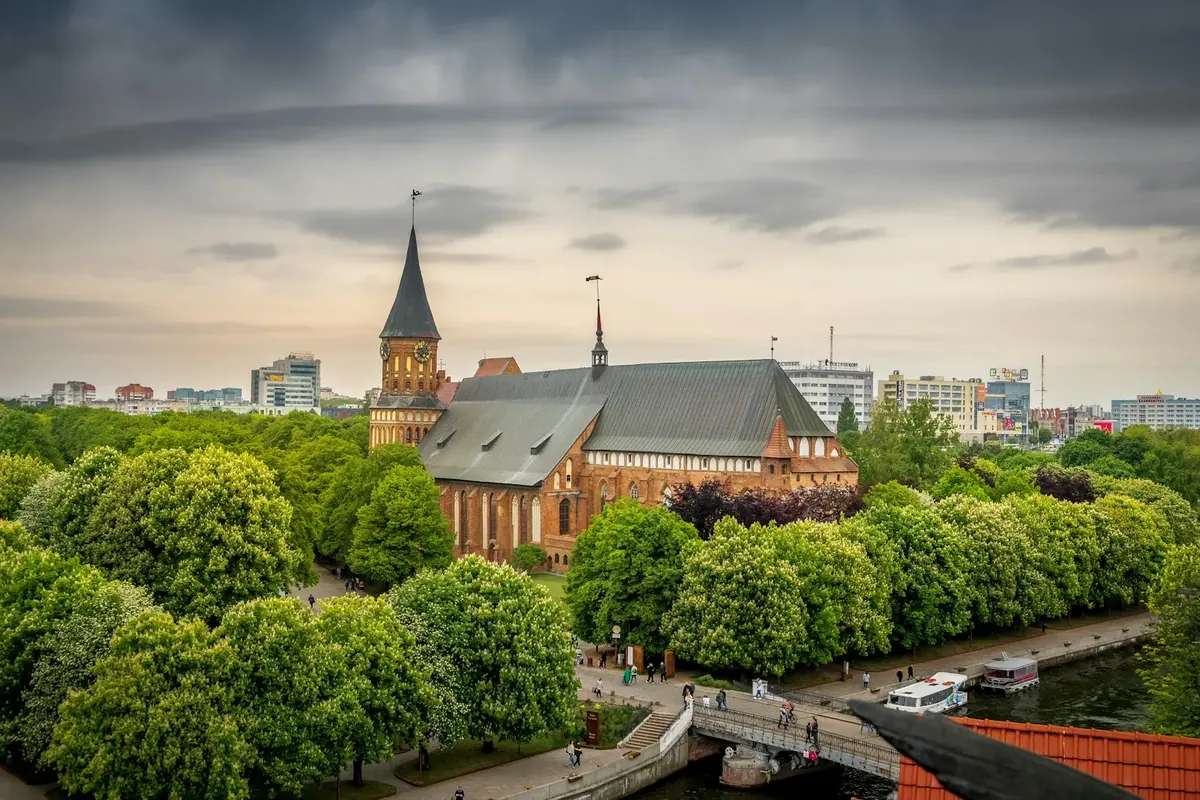 Kaliningrad Cathedral on Kneiphof island and the Pregolya river under a cloudy sky