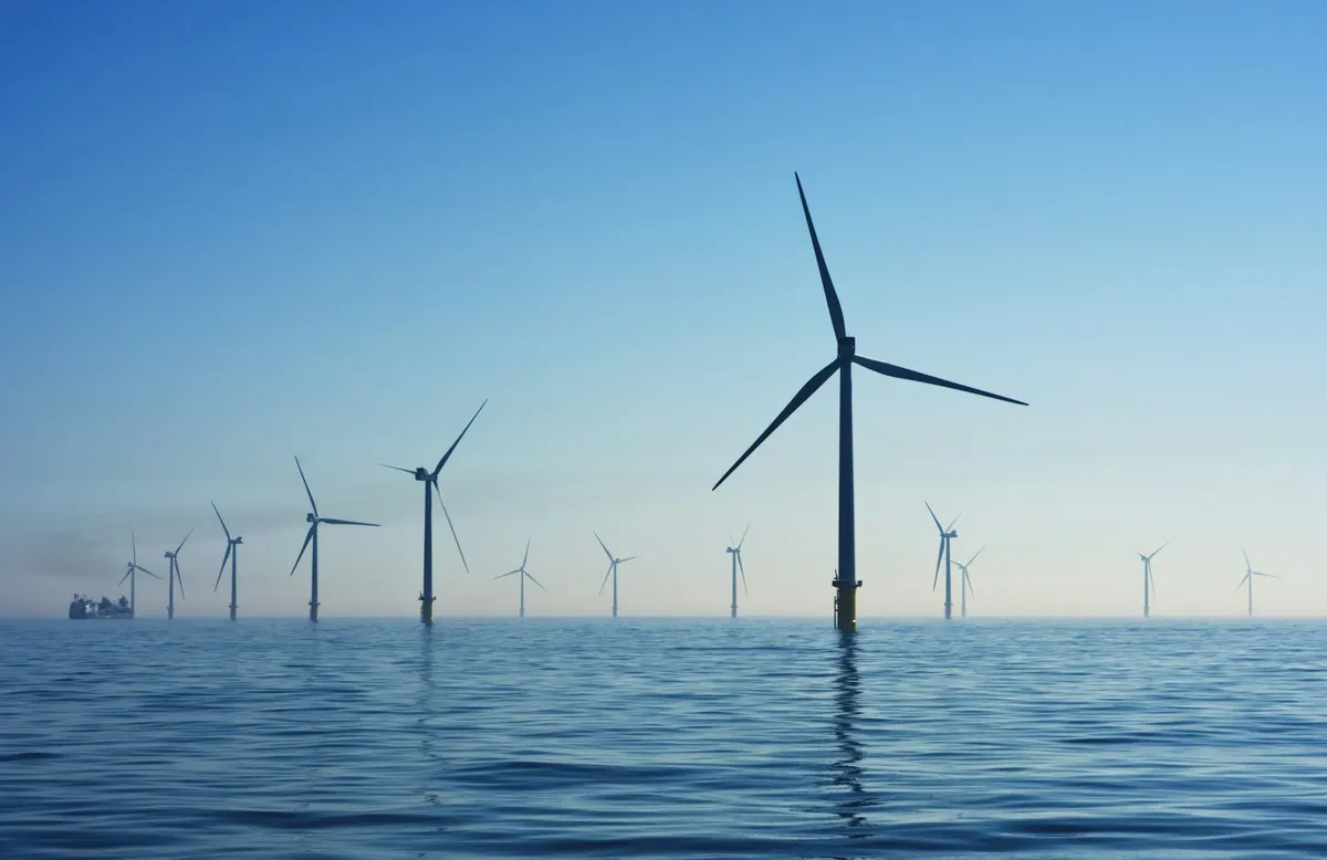 Offshore wind turbines standing in a calm sea