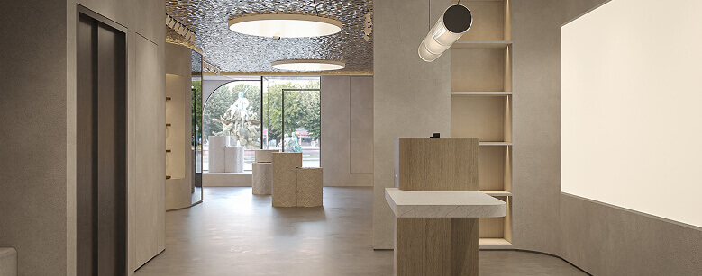 Entrée de magasin épurée avec banque d'accueil en bois et plateau blanc, sous un plafond lumineux