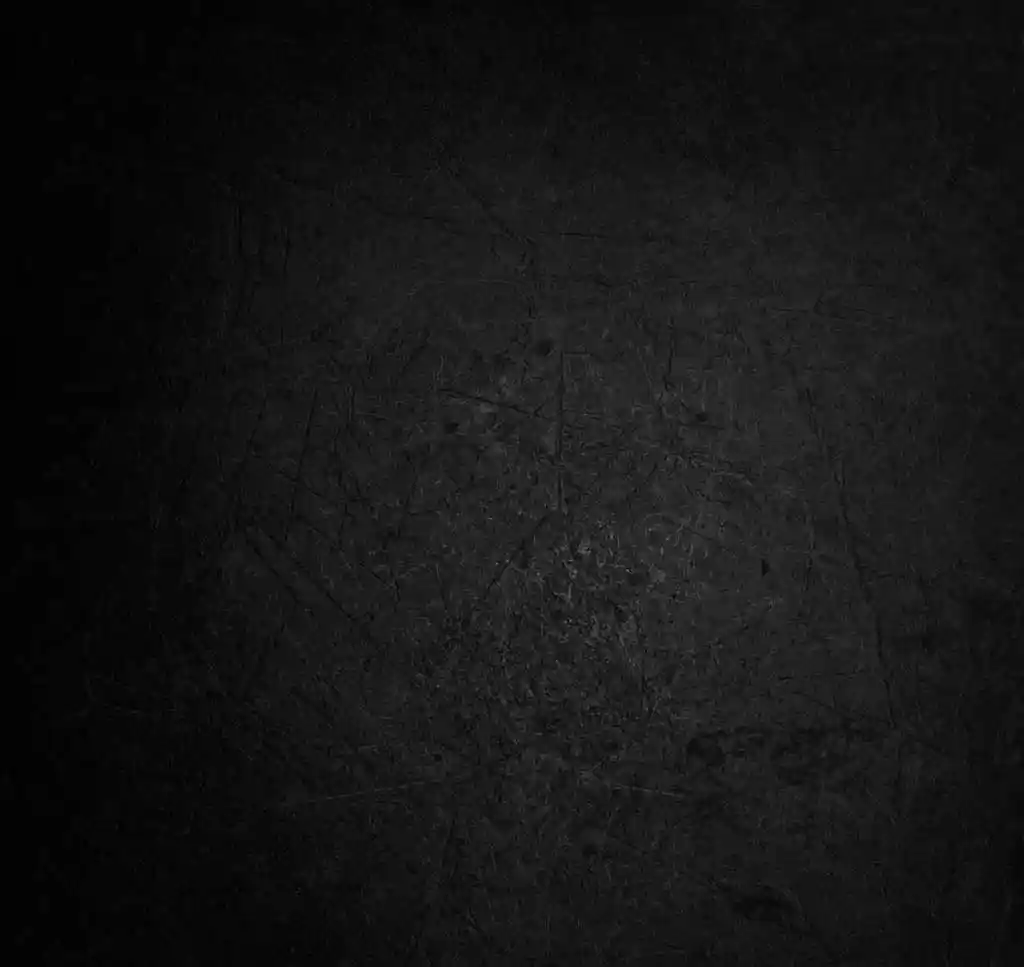 Dark textured background with subtle black gradient and rough industrial surface pattern