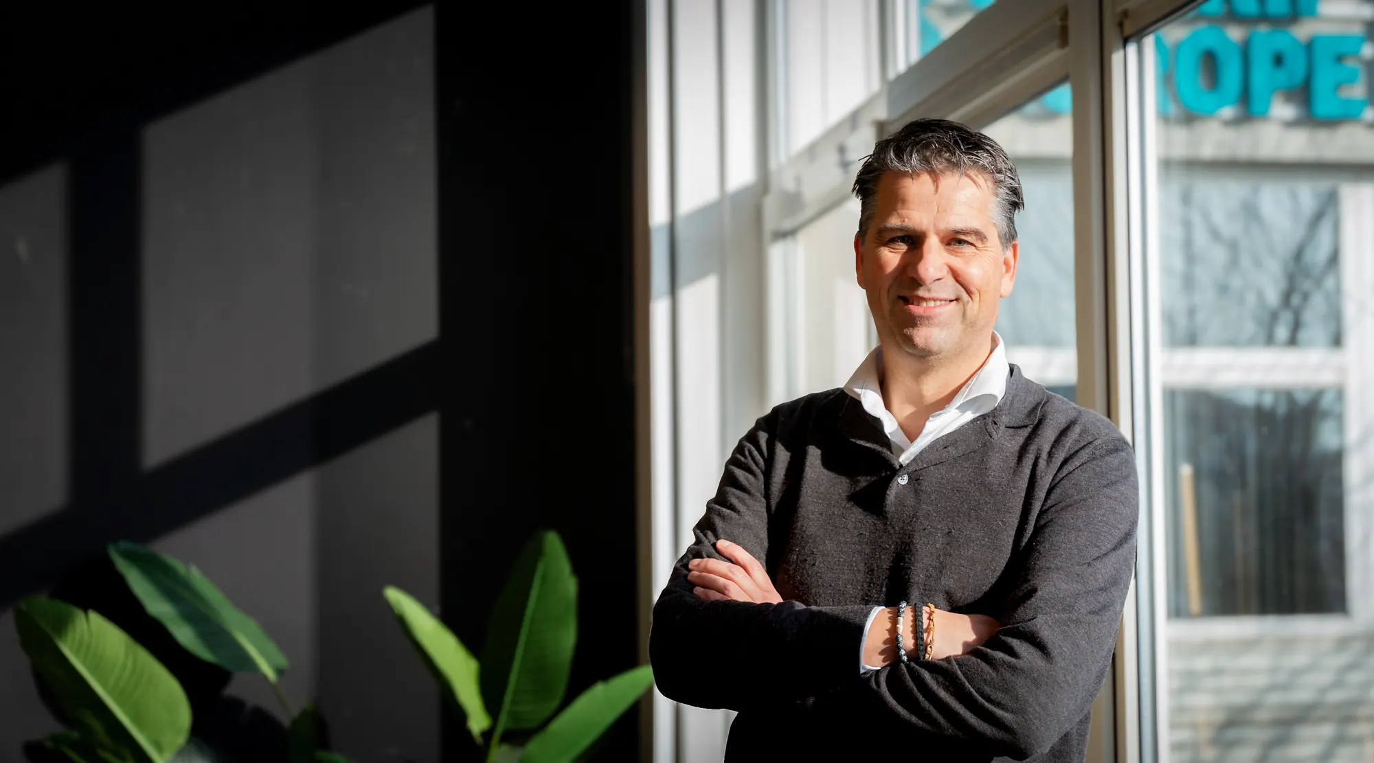 Remco from Pro Contact by the window in the office