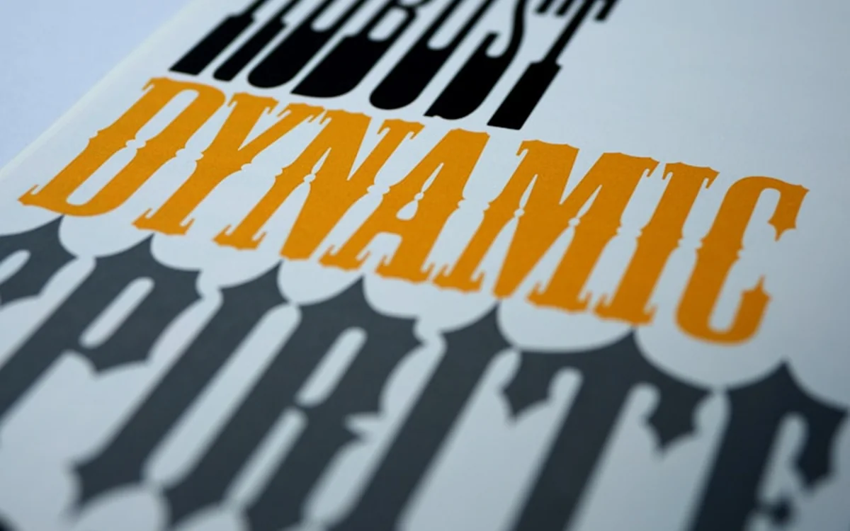 Letterpress poster reading DYNAMIC in orange and black type