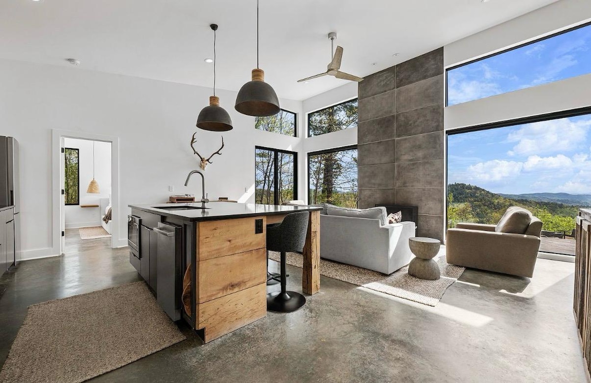 Kitchen island with pendant lights opening onto the living room and the ridgeline