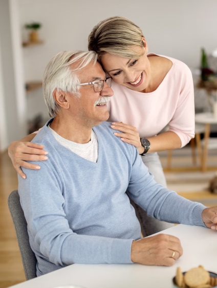 happy-woman-embracing-her-senior-father-home-1