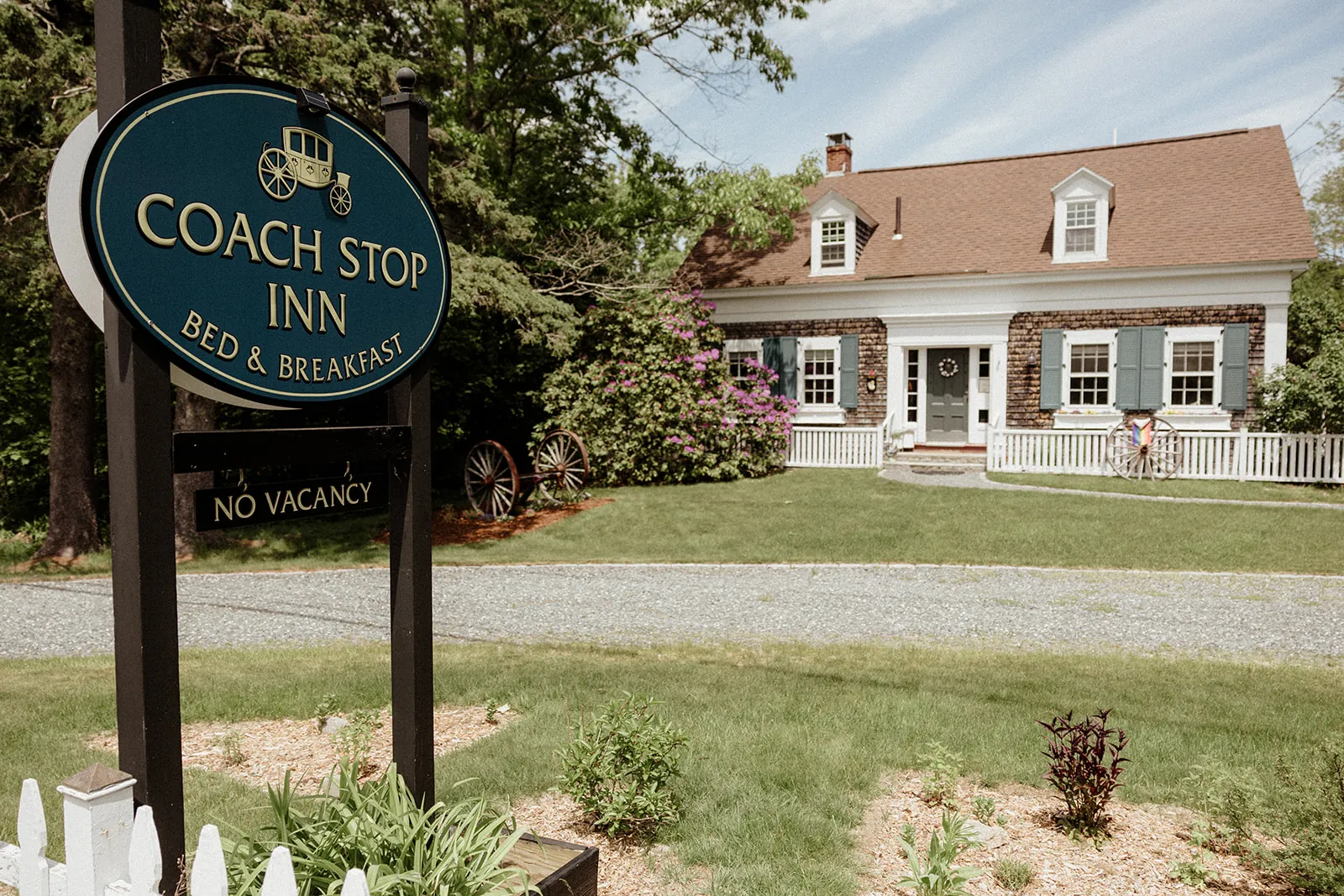 Coach Stop Inn exterior and roadside sign in Bar Harbor, Maine