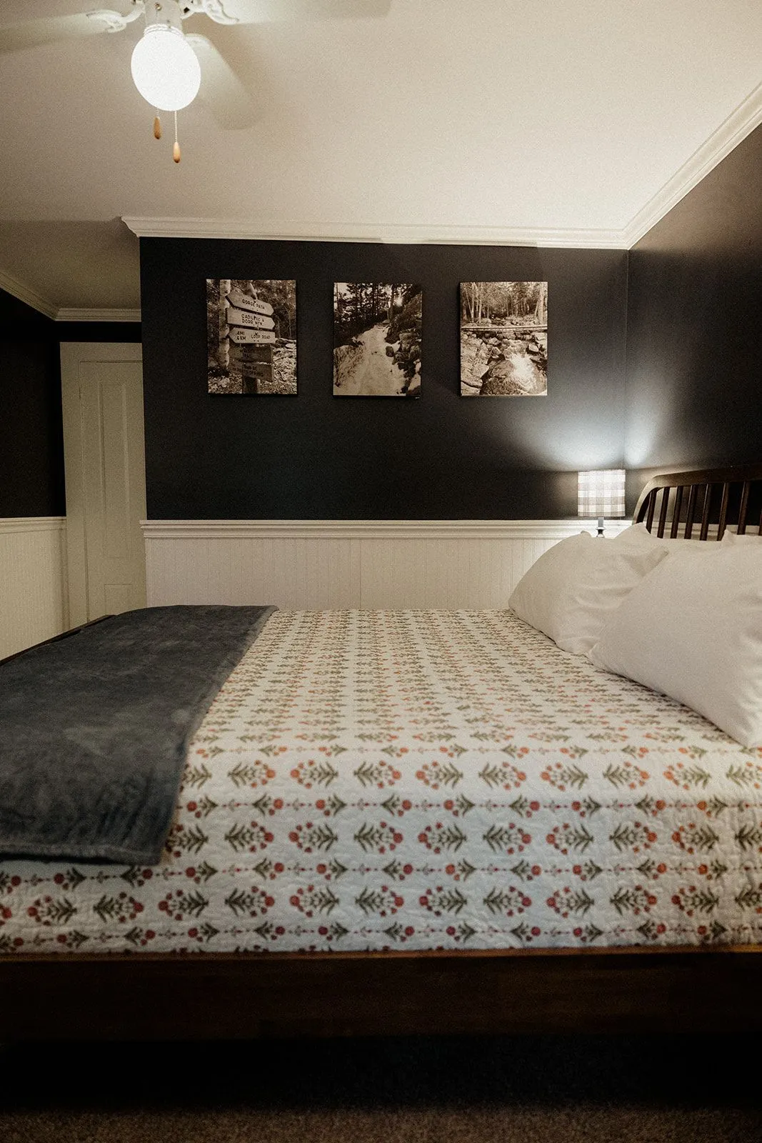 Blue Hill Bay guest room with king bed and loveseat at Coach Stop Inn