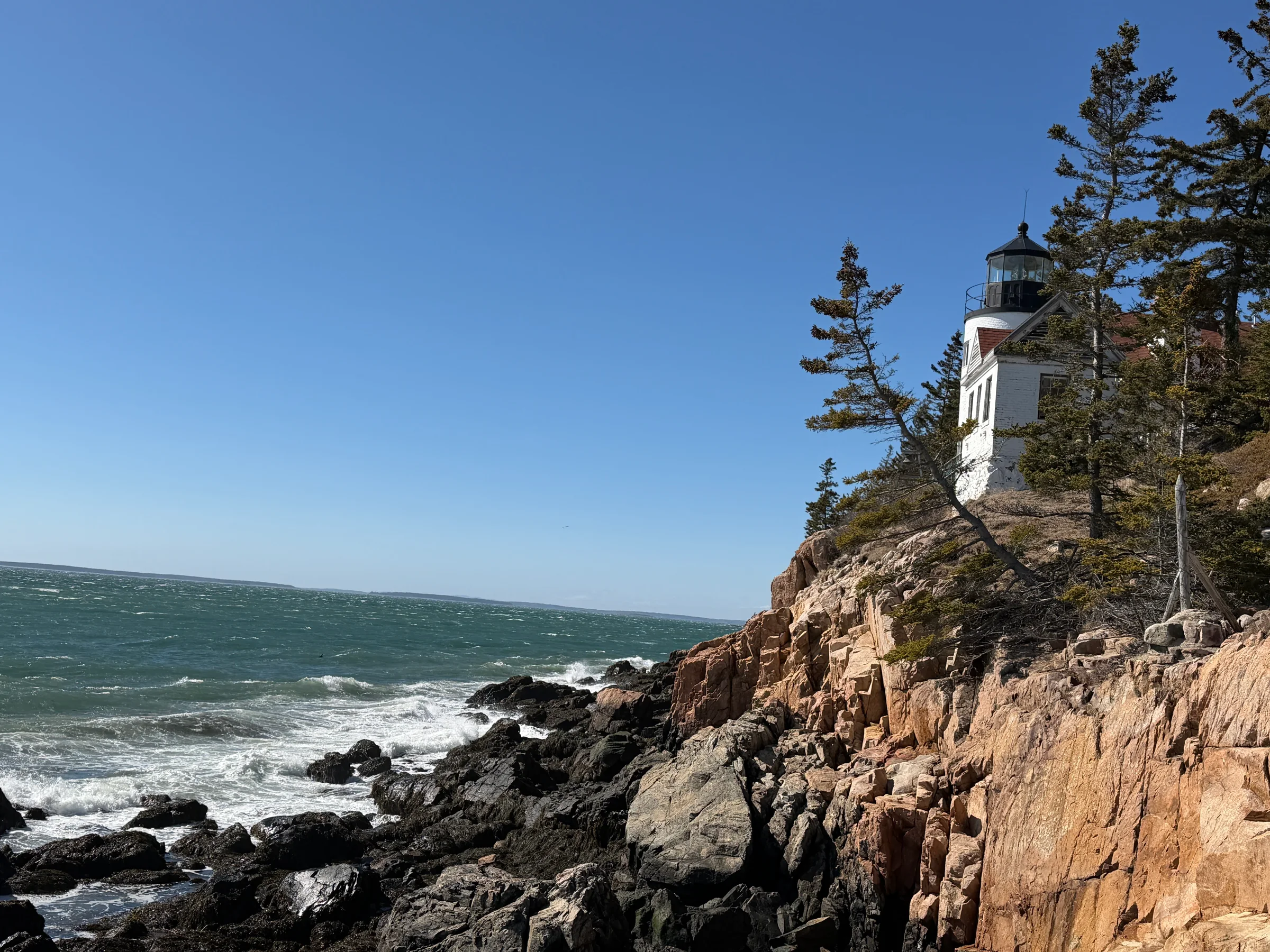 Coastal shoreline landscape with lighthouse on Mount Desert Island
