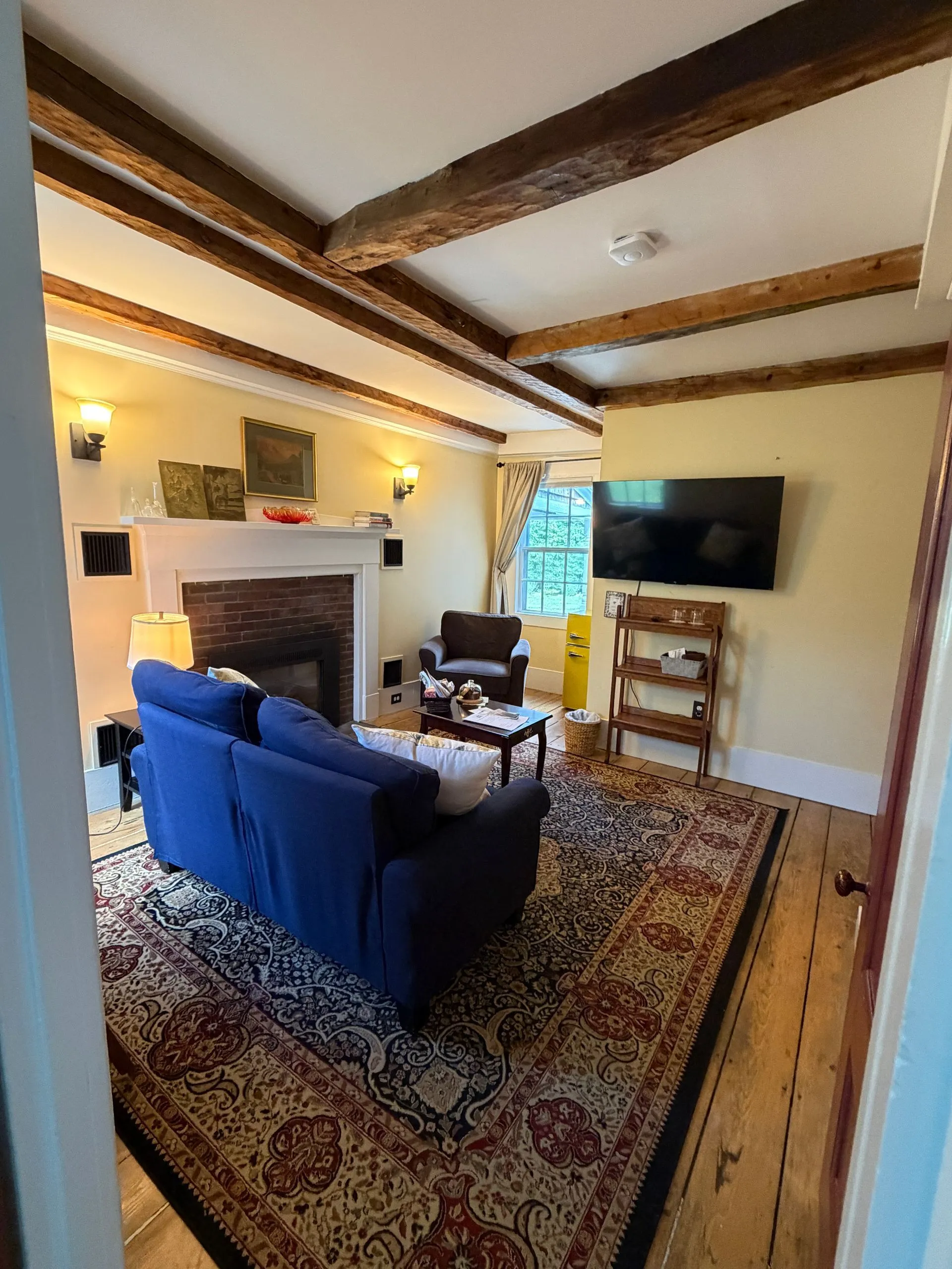 Separate living room in the Tavern suite at Coach Stop Inn