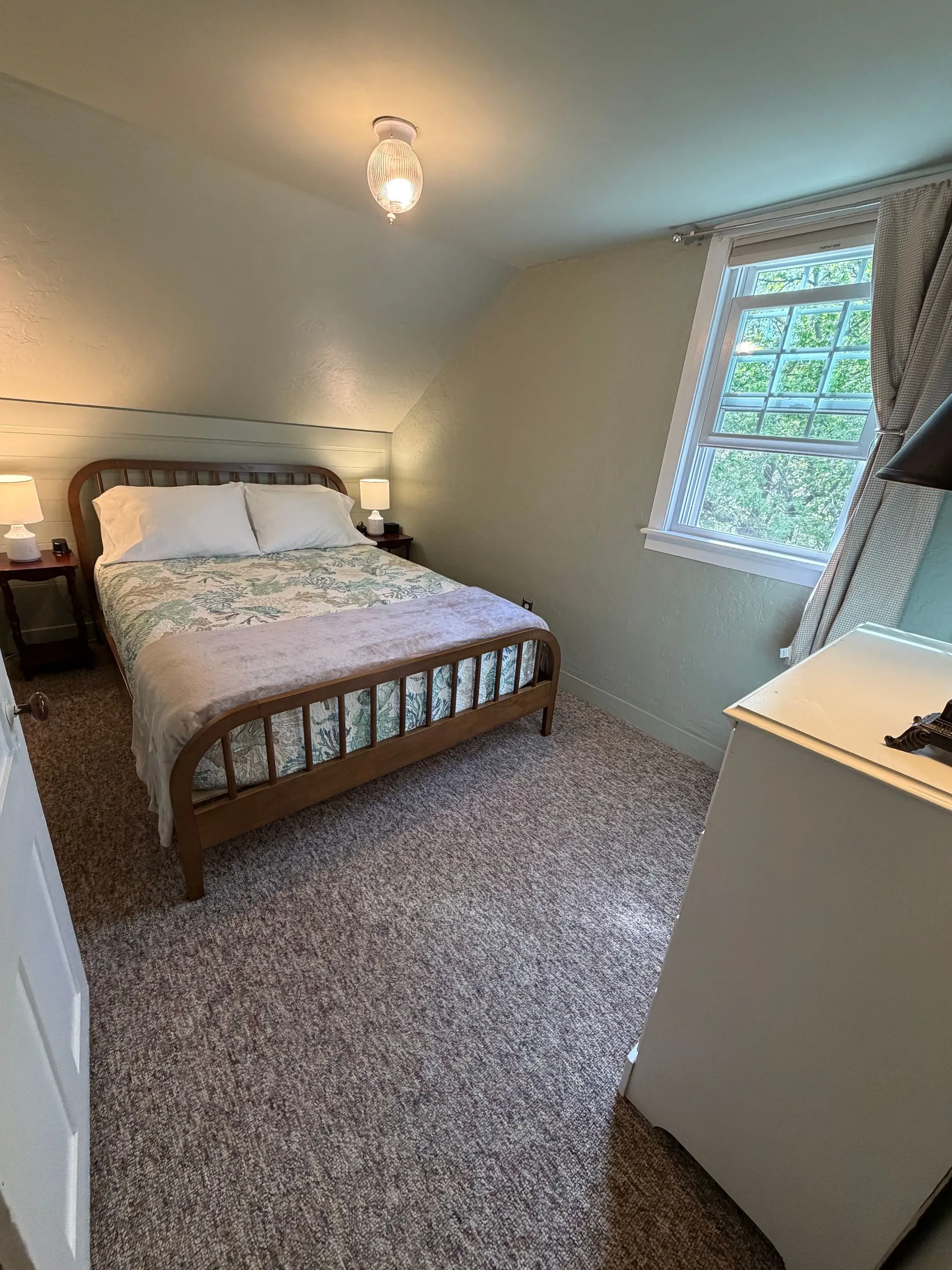 Queen bedroom in the Abbe suite at Coach Stop Inn