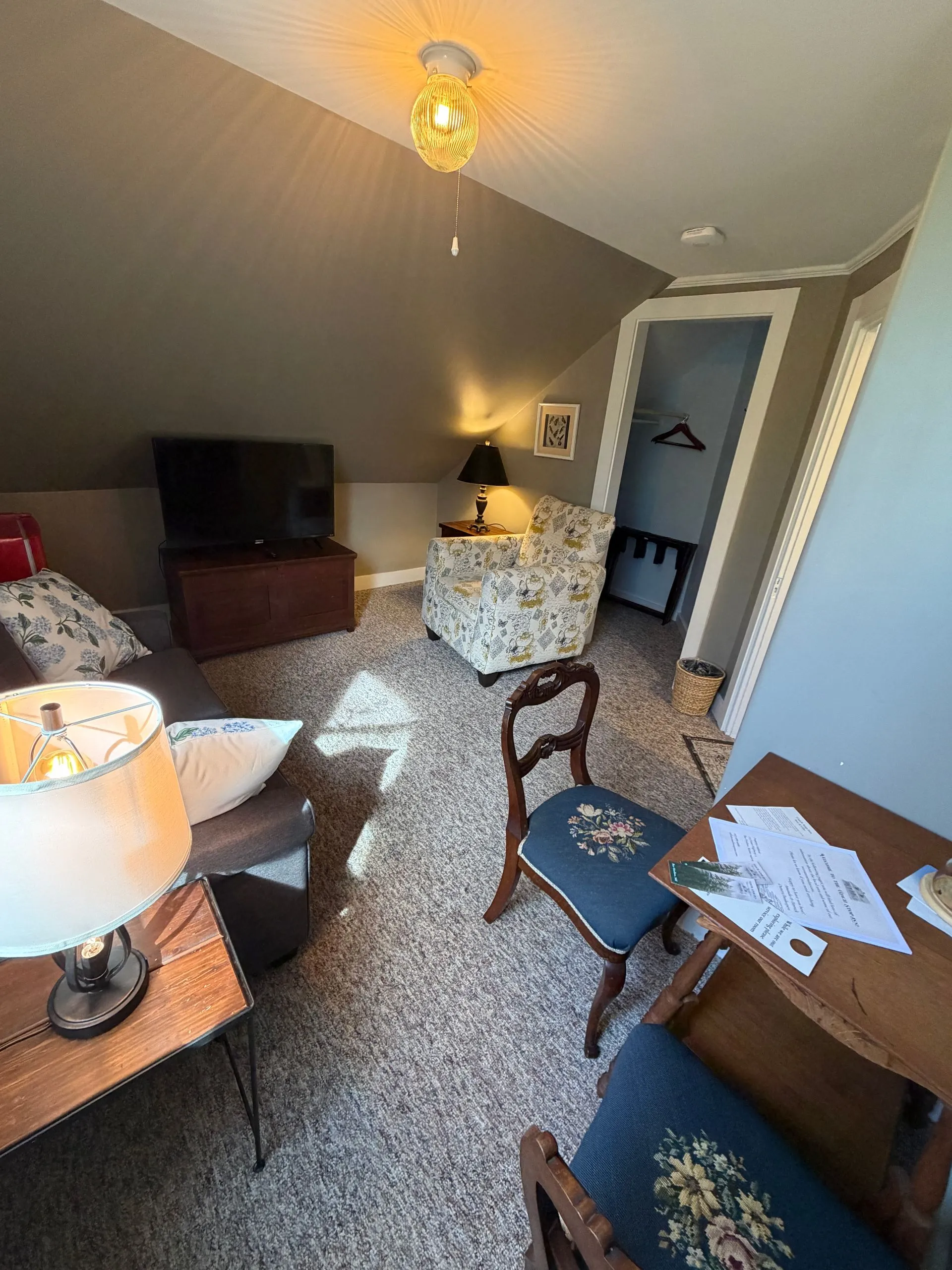 Living room and twin pullout in the Abbe suite at Coach Stop Inn