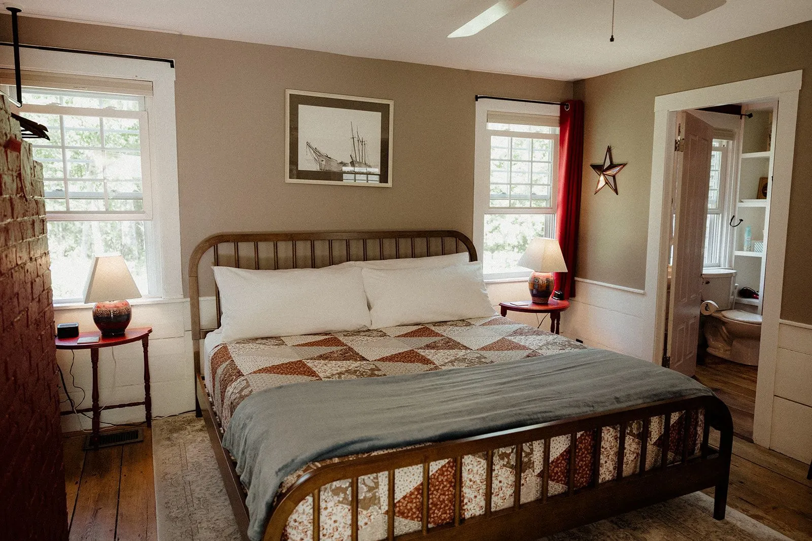 King bed and seating area in the Heritage room at Coach Stop Inn