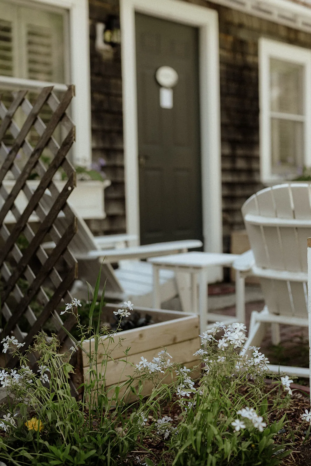 Private patio seating outside the Blue Hill Bay room at Coach Stop Inn