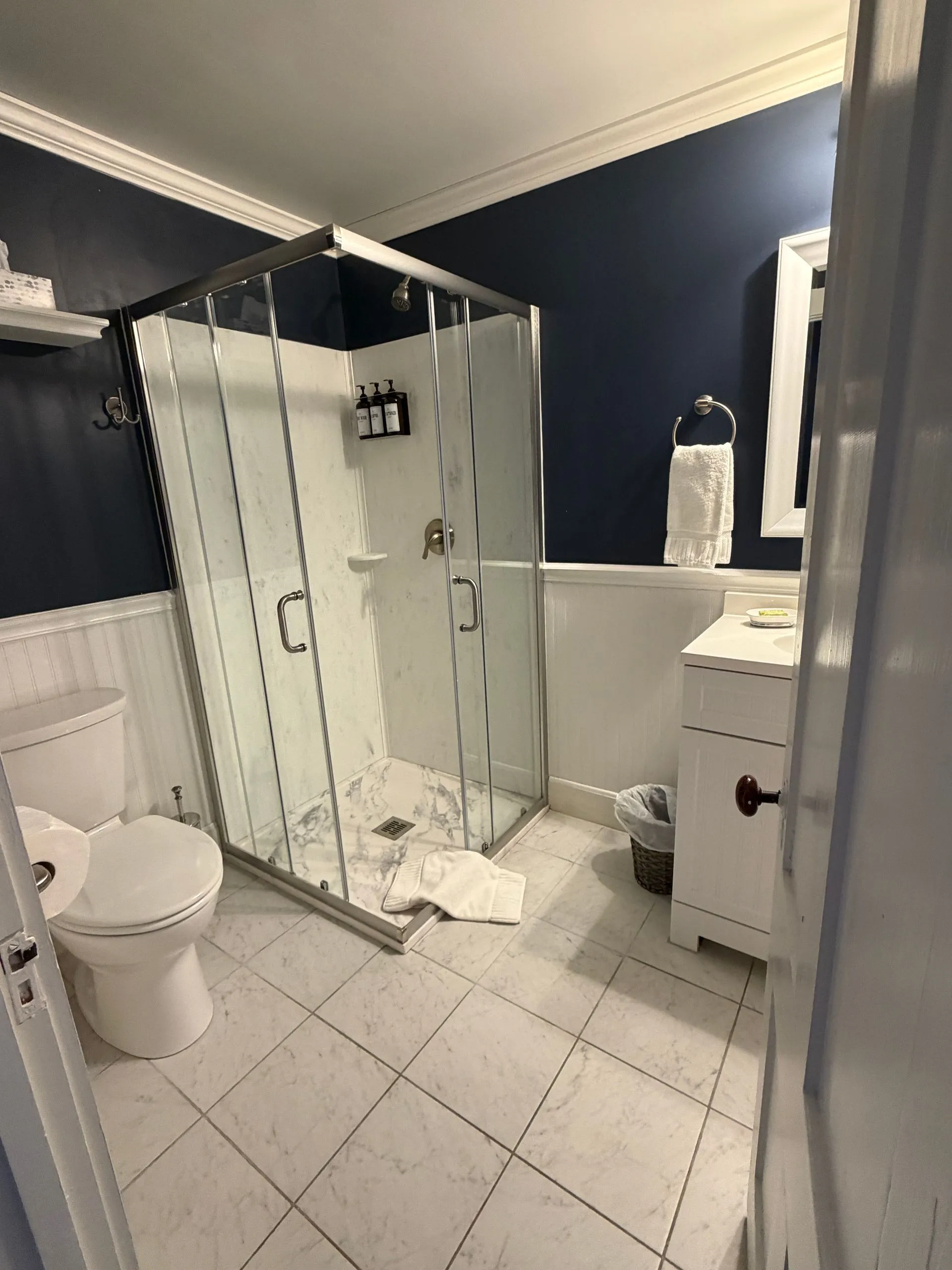 Private bathroom with walk-in shower in the Blue Hill Bay room at Coach Stop Inn