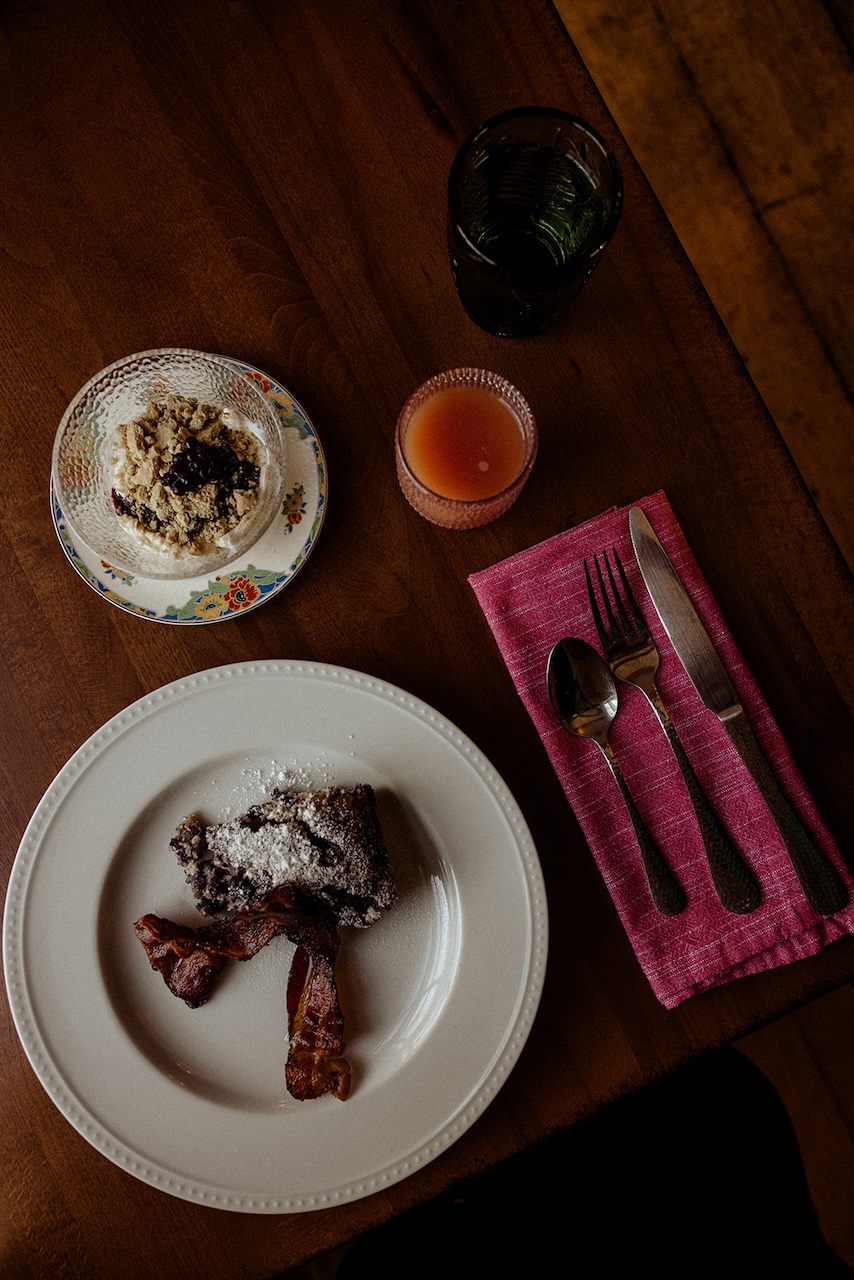 Overhead view of a plate and bowl on top of a wooden table
