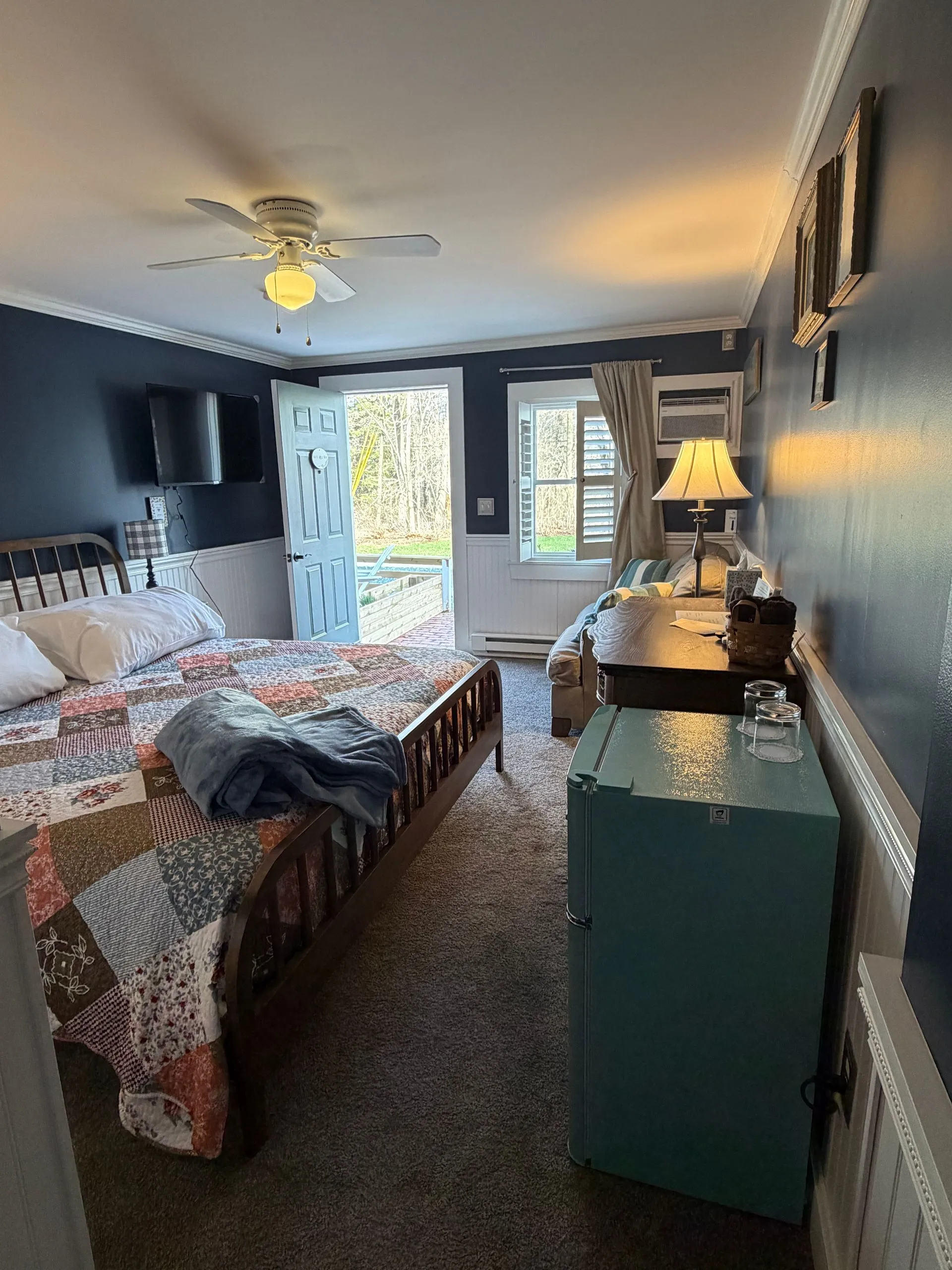 King bed and minifridge in the Blue Hill Bay room at Coach Stop Inn