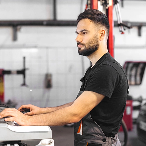 Technician running an ADAS calibration on the computer