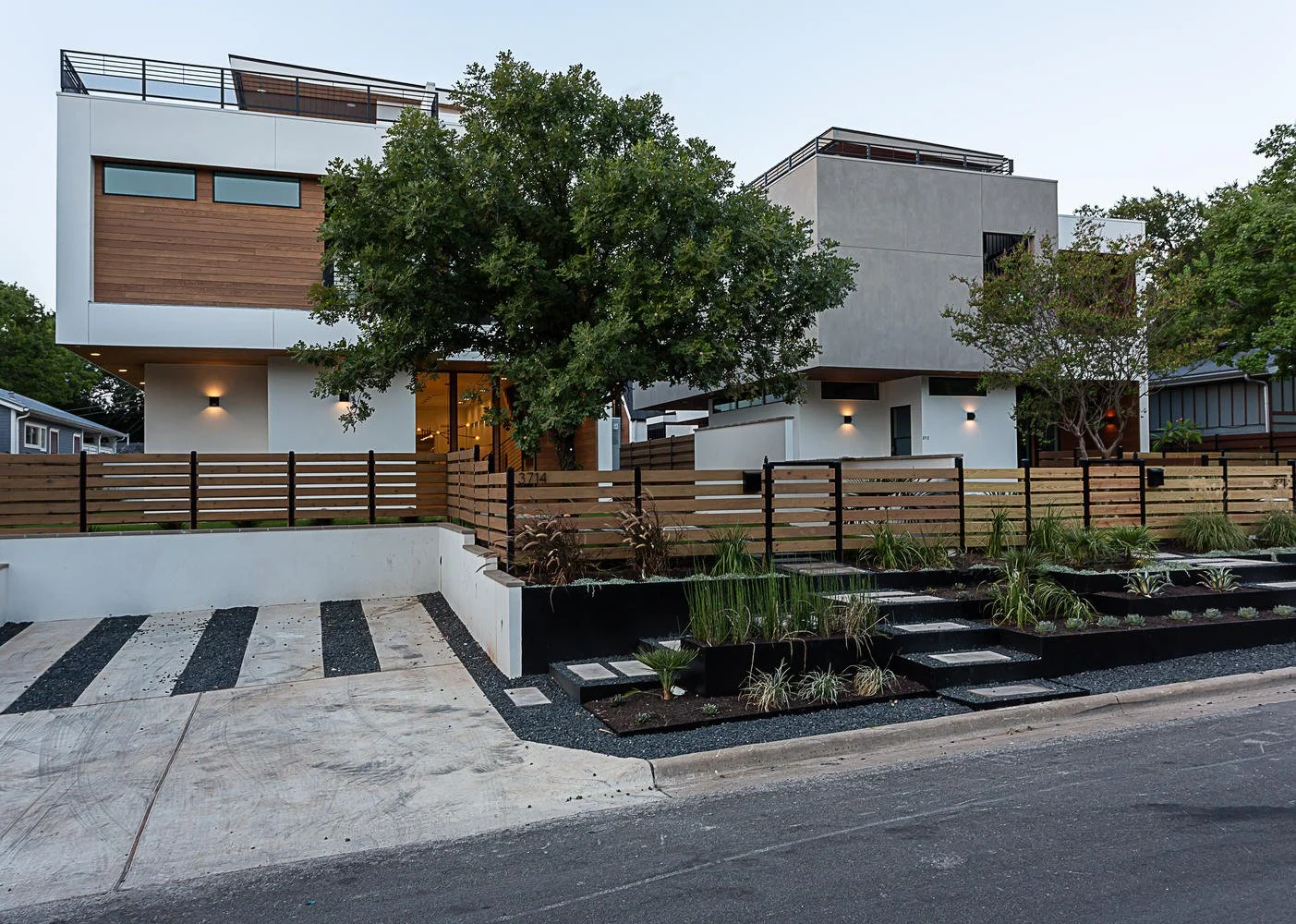 Bonnie A finished home exterior by SMART Interiors & Concrete