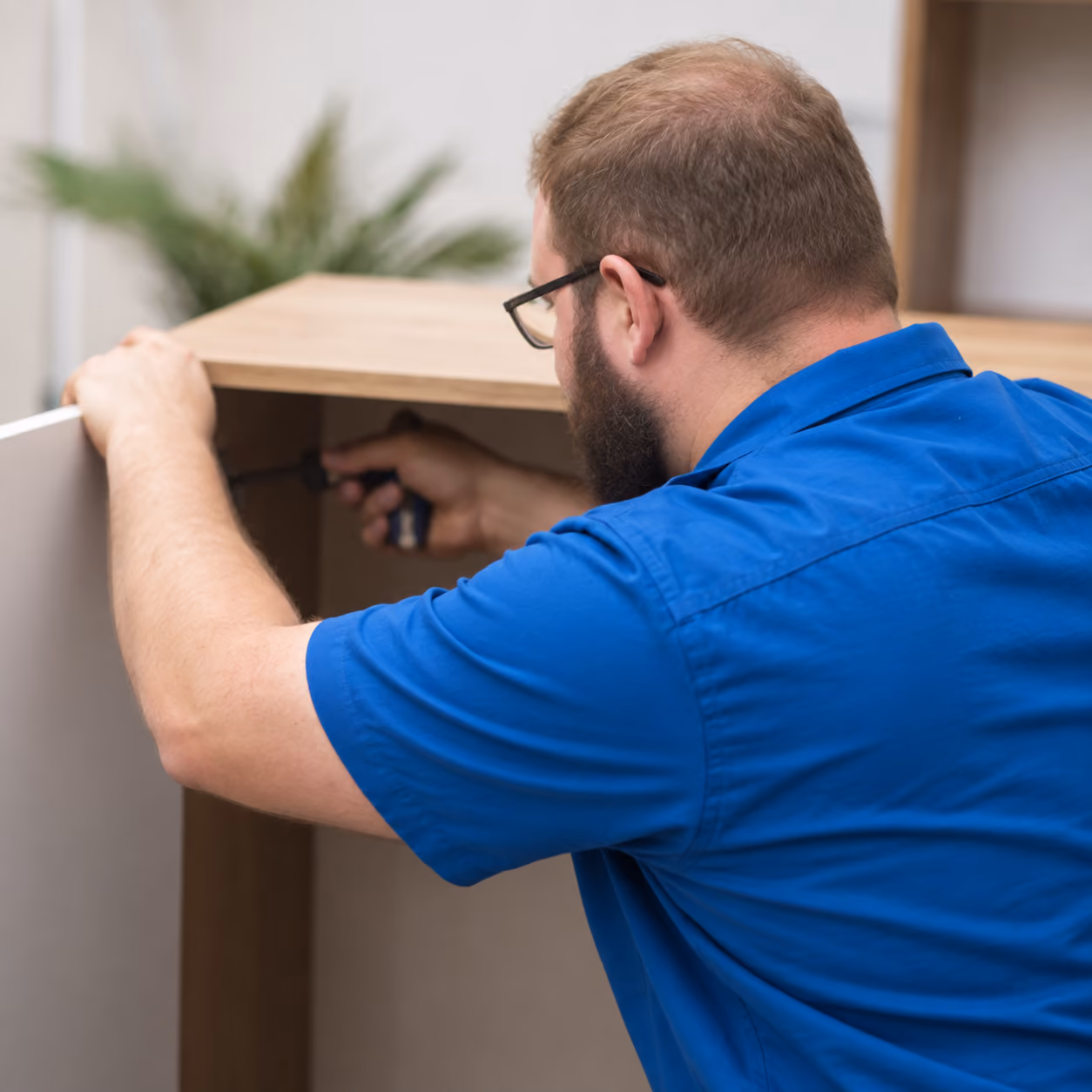 TechSmart Handyman assembling furniture in a Nampa home