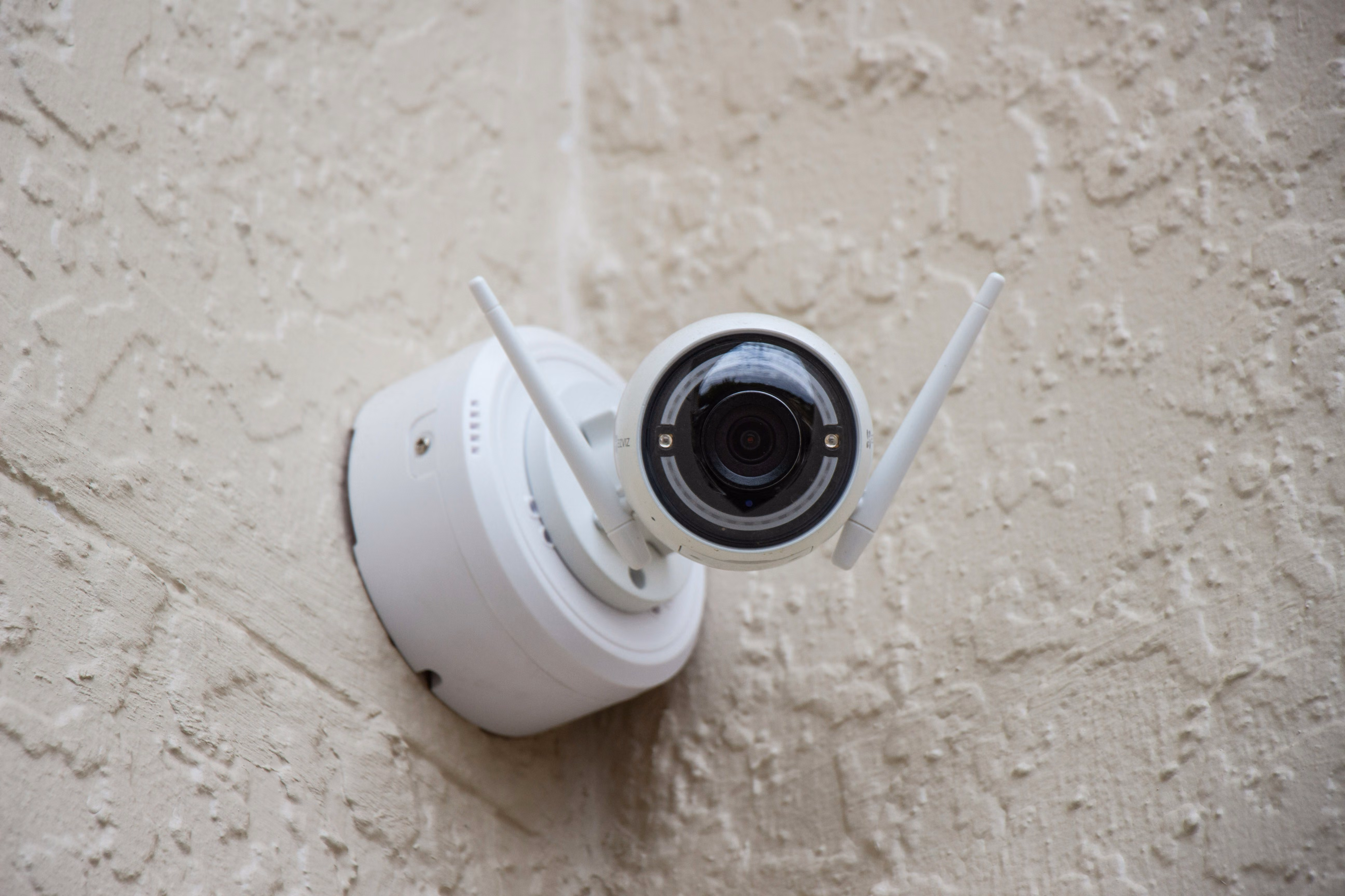 Outdoor security camera professionally installed on a home