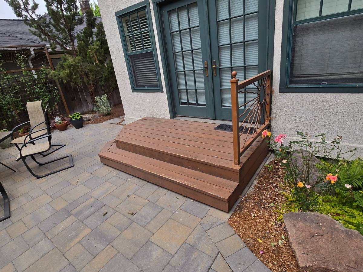 Deck steps before refinishing, with faded brown wood