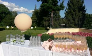 Outdoor welcome drink station with champagne glasses