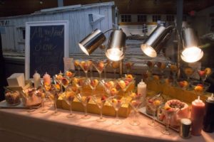 Mini donut dessert bar under warming lamps