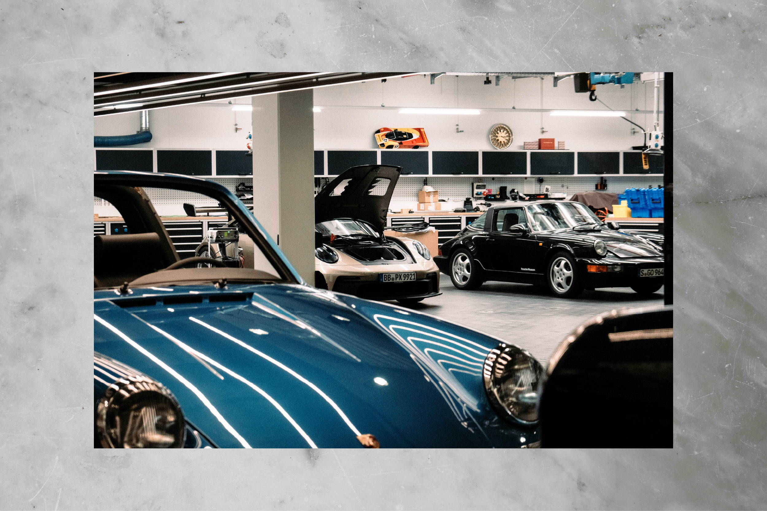 Collector cars parked inside a private garage